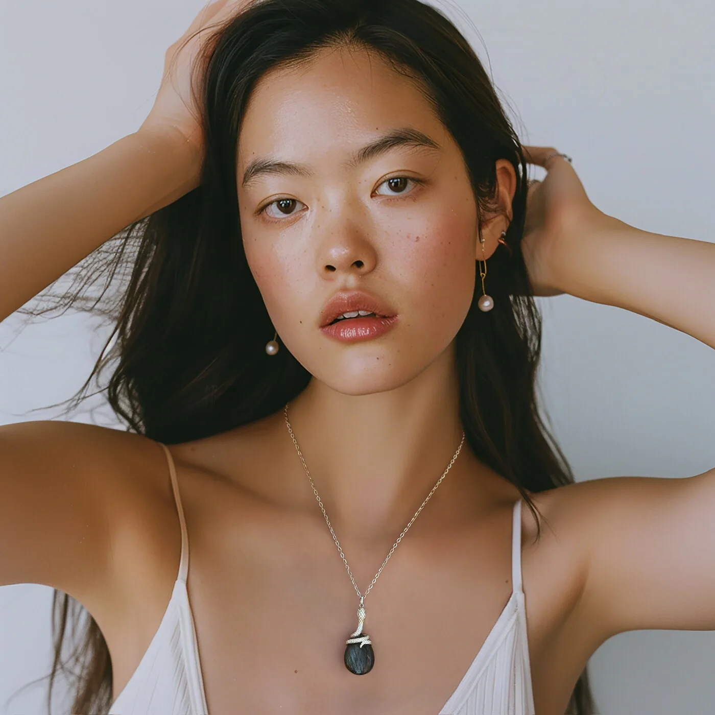 Model wearing Ormiro snake pendant